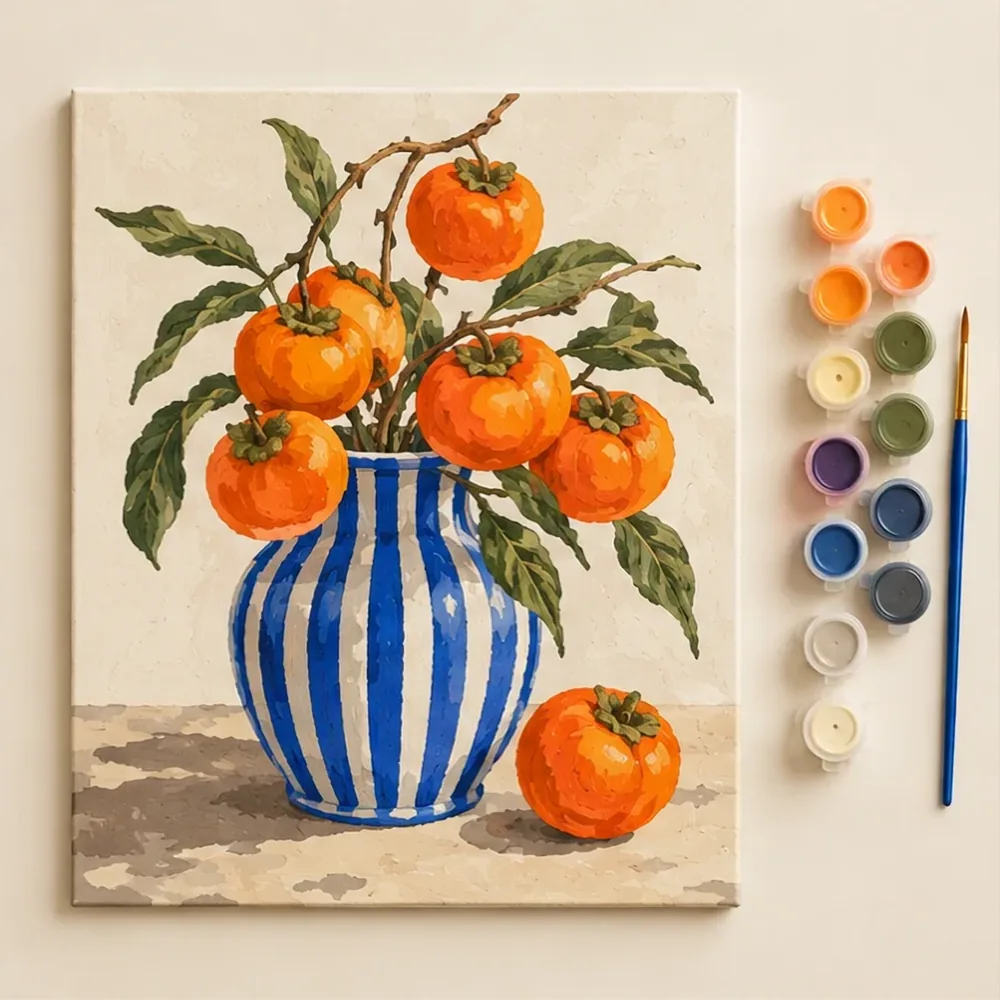 A finished paint by number picture of fruit in a striped vase, next to its paint pots and brush